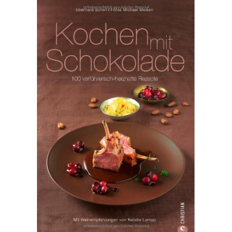 Kochen mit Schokolade ist ein Buch von Schell Schokoladen mit 100 verführerischen Rezepten. Auf einem braunen Teller Ist Fleisch in Schokosoße und Cranberrys zu sehen, dahinter sind zwei Schalen mit Cranberrys und gefüllt